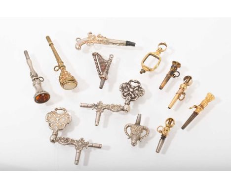 Group of antique and later watch keys to include a novelty silver flintlock pistol etc 