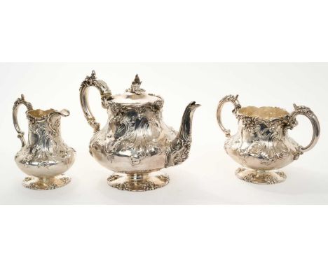 Victorian three piece silver teaset, comprising teapot of baluster form, with embossed foliate and scroll decoration, engrave