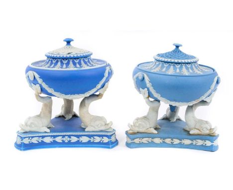 A rare near pair of Wedgwood jasperware pastille burners, circa 1805, the burners supported by three stylised dolphins, decor