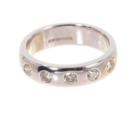 Platinum and diamond eternity ring with five brilliant cut diamonds estimated to weigh approximately 0.50ct in total, in plat