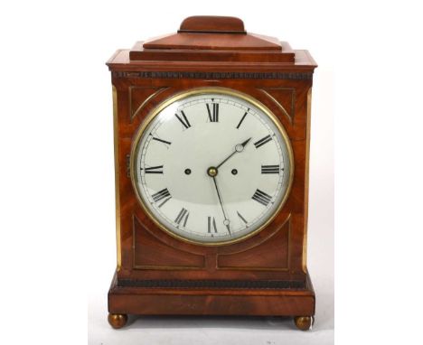 Regency mahogany bracket clock with painted dial, twin fusee movement striking on bell in mahogany case on gilt ball feet. 41