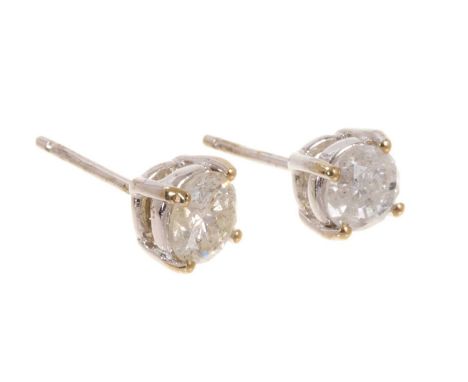 Pair of diamond single stone stud earrings in four claw 18ct white gold setting. Estimated total diamond weight approximately