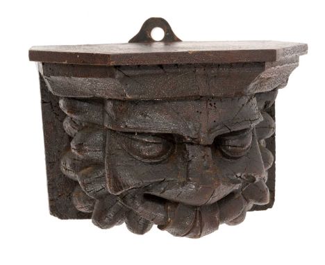 Early carved oak 'Green Man' shelf bracket, 24cm wide