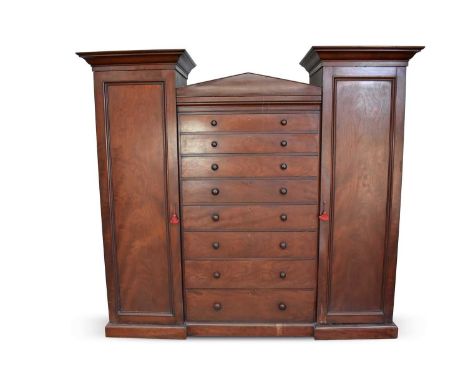 William IV/early Victorian mahogany Beaconsfield wardrobe, with eight graduated drawers to the central arched section, flanke