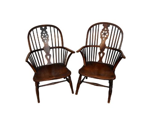 Near pair of early 19th century ash, fruitwood land elm Windsor chairs, each with wheel back and saddle seat on splayed ring 