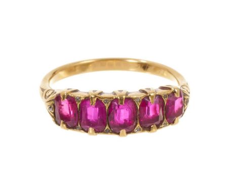 Late Victorian ruby five stone ring with five graduated oval mixed cut rubies with rose cut diamond accents to the claws in g