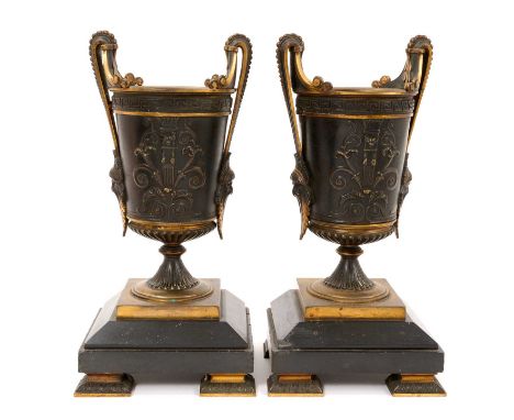 Pair of 19th century Greek revival patinated bronze niche urns, each with twin handles with mask terminals, anthemion and Gre