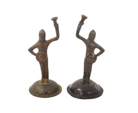 Pair of bronze figure wick light holders, with supports in the form of Medieval knights, 20cm high