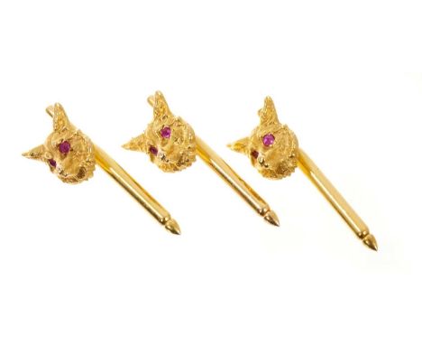 Three 14ct gold hunting studs/buttons, the fox masks with ruby eyes, on a spring loaded gold pinsWeighs approximately 6.9 gra