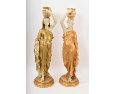 Pair Royal Worcester candlesticks in the form of classical maidens, stamped marks, 51cm highOne has a chip to the rim of the 