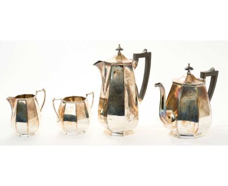1930s four piece silver teaset, comprising teapot of faceted form, with hinged domed and faceted cover and angular ebony hand