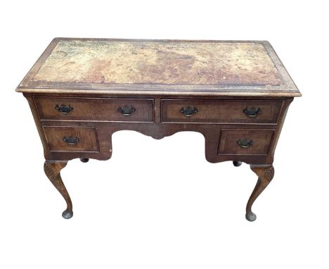 Queen Anne style walnut and leather inset writing table, with six drawers about the kneehole, on shell carved cabriole legs, 