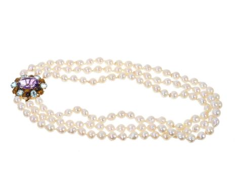 Cultured pearl three strand necklace, the triple strand of Baroque cultured pearls on a mulit-gem cluster clasp with amethyst