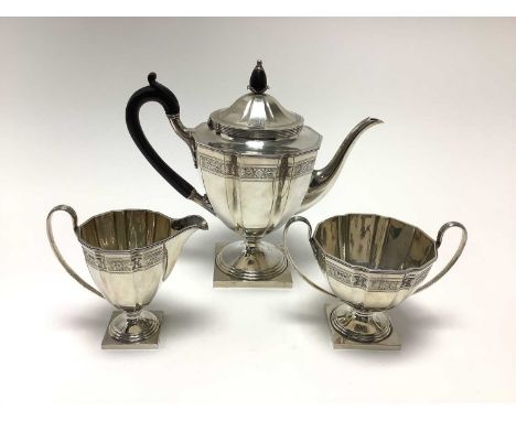  1920s silver three piece coffee set, comprising coffee pot of panelled form, with engraved decoration, hinged domed cover an