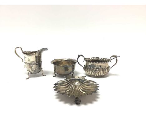 Group of 20th century sterling silver, including Georgian-style matching cream jug and sugar bowl, scallop shell dish, furthe