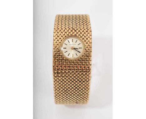 1970s ladies Zenith 9ct gold bracelet watch with circular dial on an integral 9ct gold Milanese bracelet Weight 54.2 grams Wa