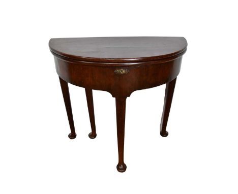 Mid 18th century walnut demi-lune side table, with fold over top, folding twice to reveal well below, raised on turned tapere