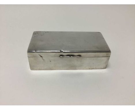 George V silver cigarette box of plain rectangular form, (Birmingham 1911), 19cm.