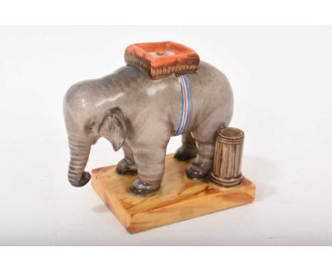 Continental porcelain inkwell, in the form of an elephant, circa 1850-60, shown standing on a square base, 8cm high