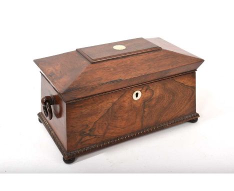 Regency rosewood sarcophagus shaped tea caddy with two original rosewood canisters and cut glass mixing bowl, 35cm wide