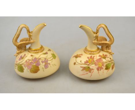 A pair of Royal Worcester blush ivory jugs painted with gilt highlighted sprays of flowers, shape 1048, 11 cm h. (2) Conditio