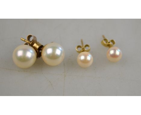 Two pairs of cultured pearl stud earrings with yellow metal fittings