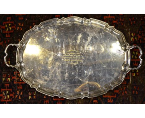 A heavy quality silver oval tray with pie-crust rim and twin handles, makers R. McD & Co., (not identified), Sheffield 1933, 