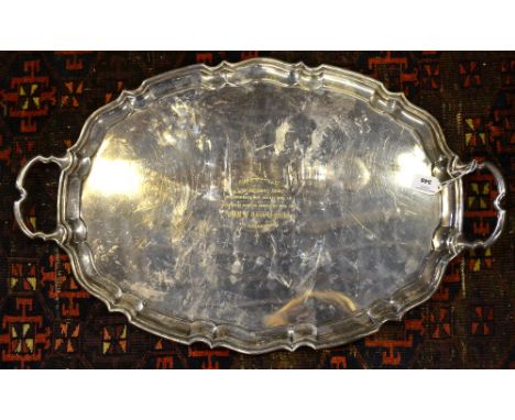 A heavy quality silver oval tray with pie-crust rim and twin handles, makers R. McD & Co., (not identified), Sheffield 1933, 