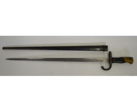 A French 1879 pattern bayonet with 52 cm T-back blade, St Etienne, curved guard and brass-mounted two-piece woodgrip, in Japa