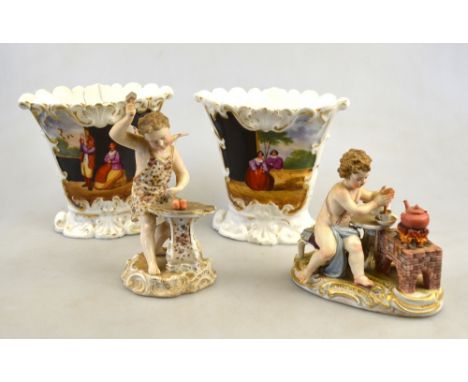 A Meissen figural group of a putti making a hot chocolate drink seated beside an open fire, raised on an oval base, 11 cm h. 