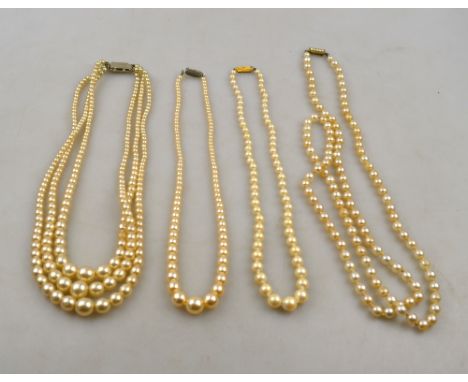 A triple row of simulated pearls on paste set snap, three single rows of simulated pearls on paste set snap to/w three gilt m