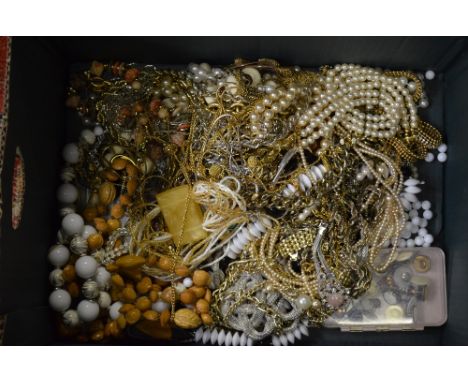 A large collection of vintage beads and chains to/w simulated pearls and a large collection of clip-on and screw earrings