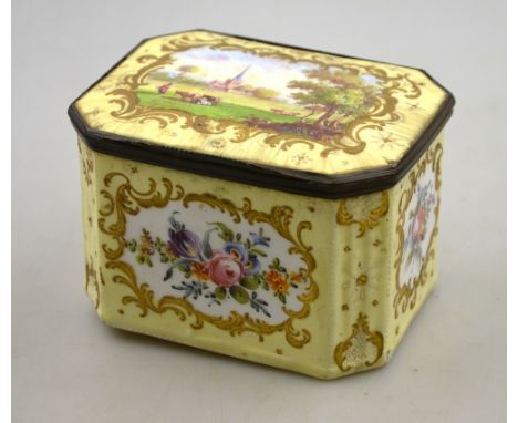 An enamel trinket box in the Georgian taste with yellow ground, the cover reserve painted with pastoral landscape with church
