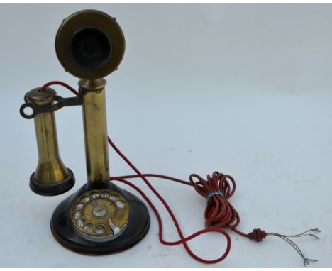 A US patent vintage brass and composite candlestick telephone with dial