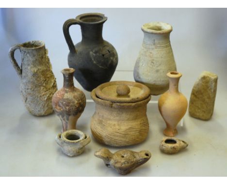 A selection on antiquity ceramic vessels, including lamps and amphorae (box)
