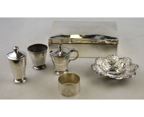 An Art Deco silver three-piece condiment set of stepped conical form, Selfridge & Co. Ltd., Birmingham 1936, to/w a pierced b