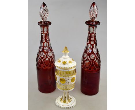 A pair of 19th century Bohemian ruby flash glass decanters, 38.5 cm h. to/w a continental white and amber glass goblet and co