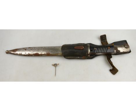 A South American gaucho knife with electroplated hilt and scabbard, richly decorated with ranching scenes, in presentation ca
