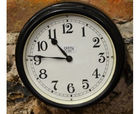 A Smith 8-day ship's bulkhead clock with enamel dial and metal case, 18 cm
