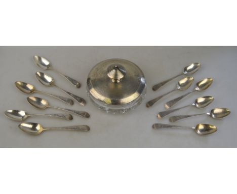 A harlequin set of twelve George III bright-cut teaspoons, various makers and dates, to/w a cut glass powder bowl, the silver