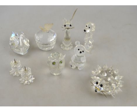 Nine Swarovski Crystal items including a large hedgehog, cat, dog, owl, swan, teddy bear and trinket pot with butterfly finia