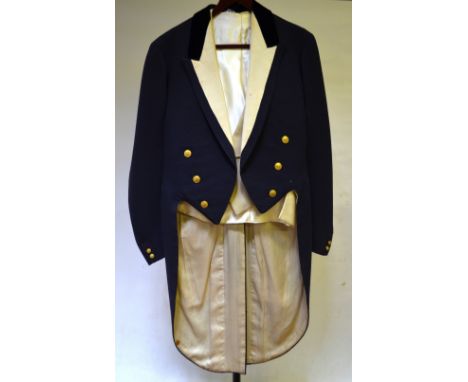 A vintage Bullingdon Club dark blue tailcoat with ribbed cream silk revere and cream silk lining, the brass buttons initialle