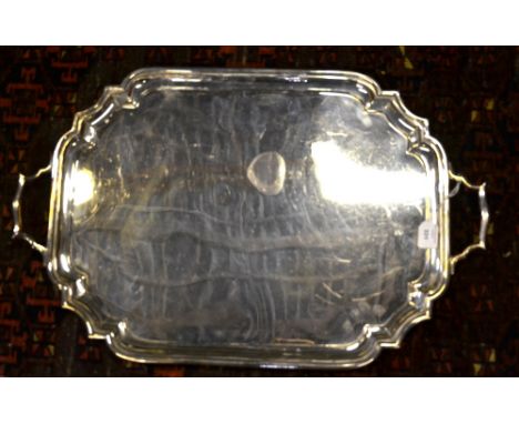 A heavy quality two-handled silver tray with canted corners and moulded rim, C. S. Harris & Sons Ltd., London 1922, 86 oz app