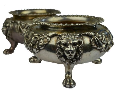 A pair of oversize Victorian heavy cast silver open circular salts with shell and gadroon rims, applied seashell garlands and