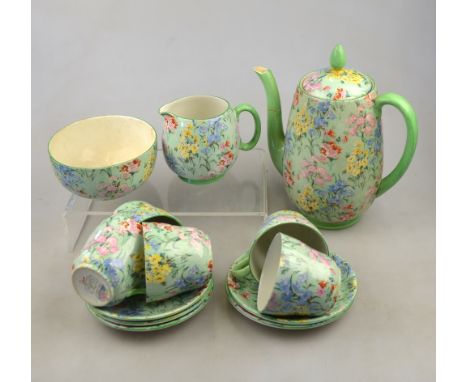 A Shelley chintz 'Melody' pattern coffee set comprising five cups and saucers, sugar basin, cream jug and coffee pot (13) Con