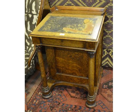 A good quality Victorian burr walnut satinwood inlaid davenport, the 3/4 galleried platform top over a hinged slope enclosing