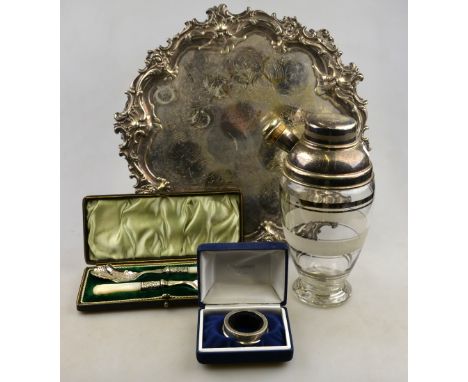 A Victorian electroplated salver with ornate cast rim and scroll feet, to/w an Art Deco glass cocktail shaker with electropla