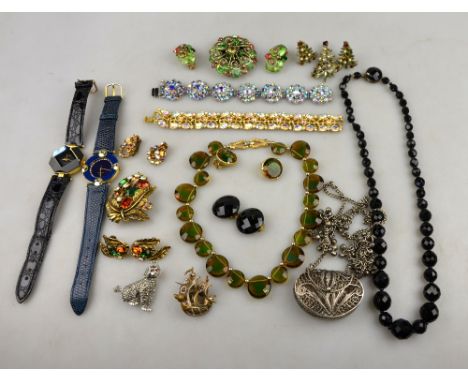A collection of vintage jewellery including matching brooch and earrings by Schreiner, matching brooch and earrings by Coralc