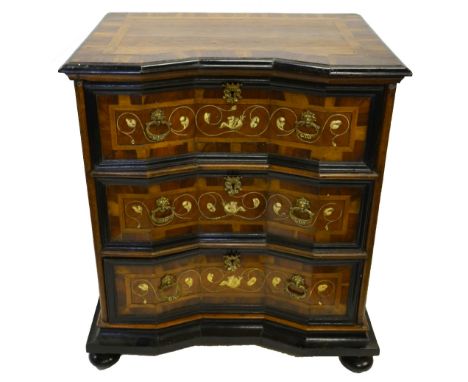 A 17th/18th century Italian ivory inlaid rosewood, walnut and ebony three drawer commode chest of inverted angular serpentine