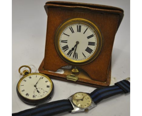 A steel-cased pocket watch with lever movement and enamel dial, to/w a travelling watch in folding leather case and a lady's 